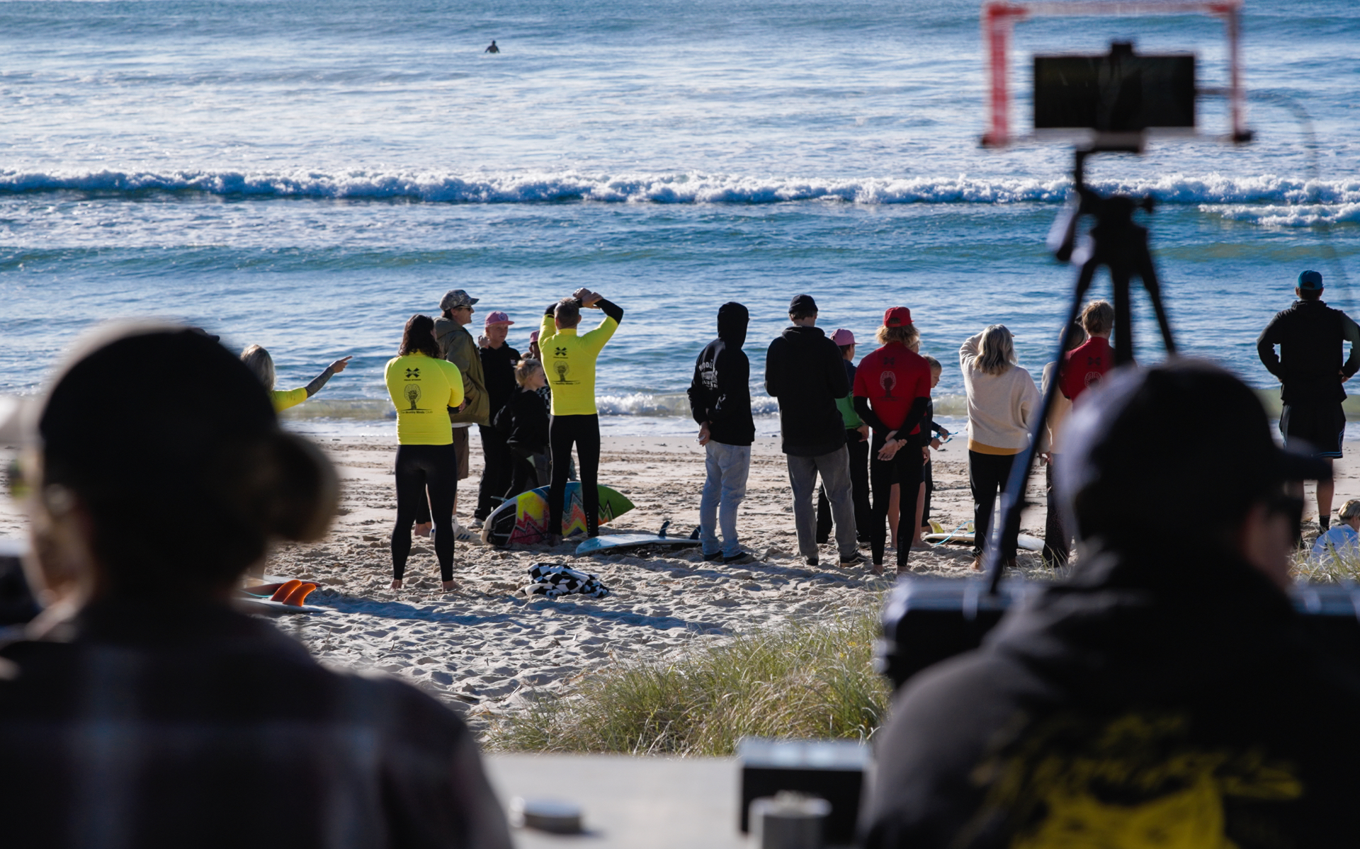 Young surfers and mentors gathered on the beach for a Healthy Minds Club event
