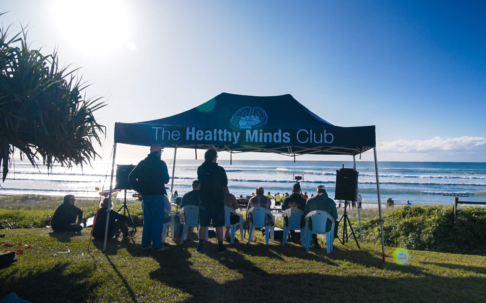 The Healthy Minds Club community tent by the ocean at a Northern Rivers event